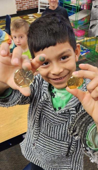 student with gold coins